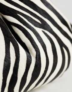 Model wearing Clover hair on real leather clutch bag in zebra