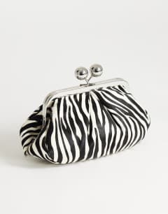 Model wearing Clover hair on real leather clutch bag in zebra