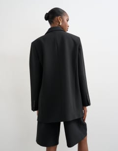 Model wearing Co ord 2 button relaxed fit blazer in black