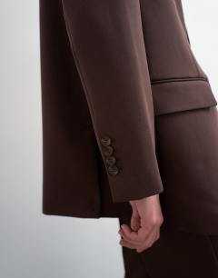 Model wearing Co ord 2 button relaxed fit blazer in chocolate