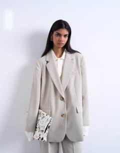 Model wearing Co ord 2 button relaxed fit blazer in stone