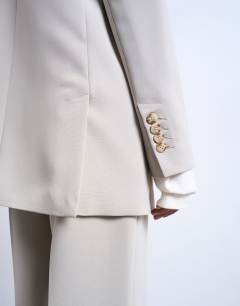 Model wearing Co ord 2 button relaxed fit blazer in stone