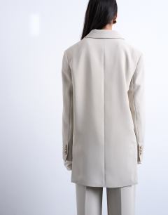 Model wearing Co ord 2 button relaxed fit blazer in stone