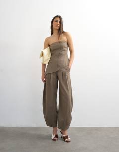 Model wearing Co ord asymmetric raw hem bandeau in brown