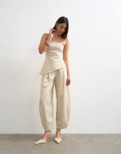 Model wearing Co ord asymmetric raw hem bandeau in stone