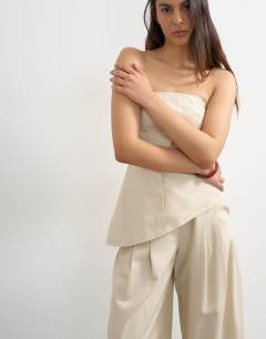 Model wearing Co ord asymmetric raw hem bandeau in stone