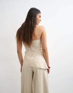 Model wearing Co ord asymmetric raw hem bandeau in stone