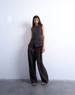 Model wearing Co ord asymmetric waistcoat in chocolate