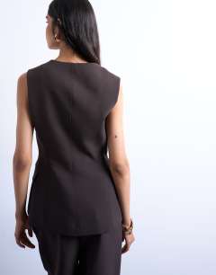 Model wearing Co ord asymmetric waistcoat in chocolate