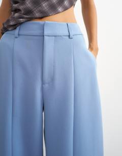 Model wearing Co ord barrel leg trouser in blue