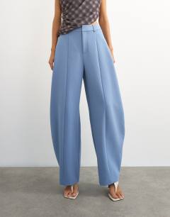Model wearing Co ord barrel leg trouser in blue