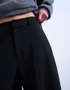 Model wearing Co ord barrel trouser in black