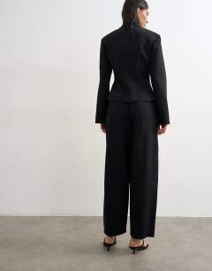 Model wearing Co ord barrel trouser in black