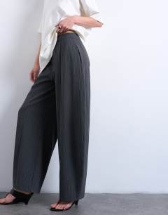 Model wearing Co ord barrel trouser in charcoal stripe