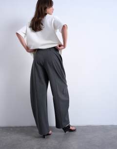 Model wearing Co ord barrel trouser in charcoal stripe