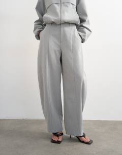 Model wearing Co ord barrel trouser in light grey