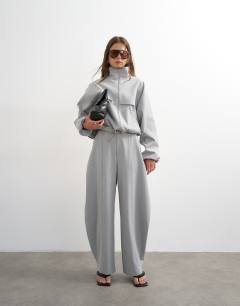 Model wearing Co ord barrel trouser in light grey