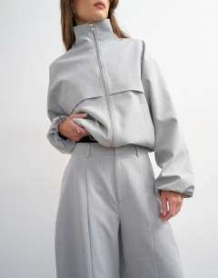 Model wearing Co ord barrel trouser in light grey