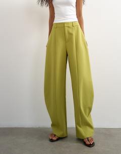 Model wearing Co ord barrel trousers in olive