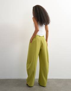 Model wearing Co ord barrel trousers in olive