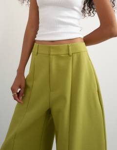 Model wearing Co ord barrel trousers in olive