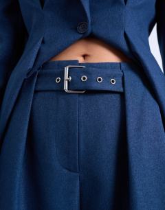 Model wearing Co ord belted highwaisted double pleat trouser in navy