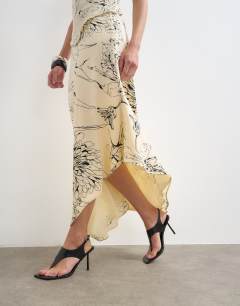Model wearing Co-ord bias maxi slip skirt in sketched mono floral