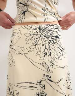 Model wearing Co-ord bias maxi slip skirt in sketched mono floral