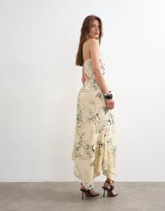 Model wearing Co-ord bias maxi slip skirt in sketched mono floral