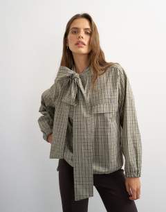 Model wearing Co-ord bomber with scarf detail in check