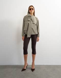 Model wearing Co-ord bomber with scarf detail in check