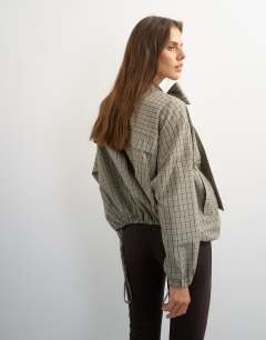Model wearing Co-ord bomber with scarf detail in check