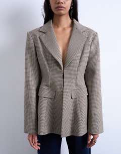 Model wearing Co ord  check cinched waist blazer in brown