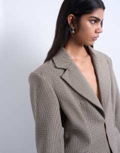 Model wearing Co ord  check cinched waist blazer in brown