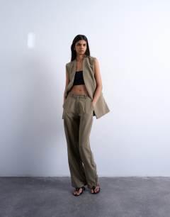 Model wearing Co ord chuck on sleeveless blazer in mushroom