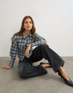 Model wearing Co ord cinch check shirt in navy