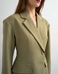 Model wearing Co ord cinched padded shoulder blazer in taupe