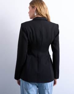 Model wearing Co ord cinched waist blazer in black