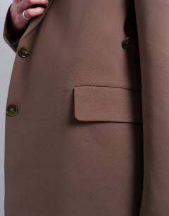 Model wearing Co ord cinched waist slouchy blazer in mushroom