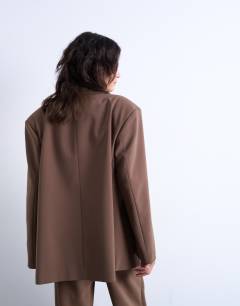 Model wearing Co ord cinched waist slouchy blazer in taupe