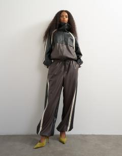 Model wearing Co-ord colour block faux leather joggers