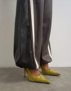 Model wearing Co-ord colour block faux leather joggers