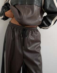 Model wearing Co-ord colour block faux leather joggers