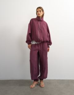 Model wearing Co ord  colour block funnel neck track jacket in fig