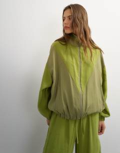Model wearing Co ord colour block funnel neck track jacket in green