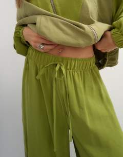 Model wearing Co ord colour block horseshoe trouser in green