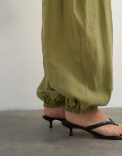 Model wearing Co ord colour block horseshoe trouser in green