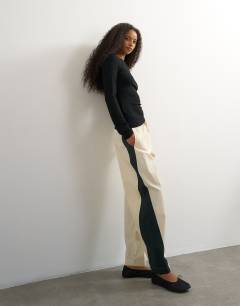 Model wearing Co ord colour block techy trouser in stone and black