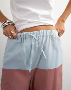 Model wearing Co ord colour block wide leg trouser in blue and mauve