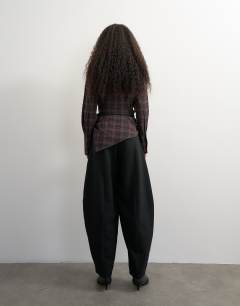 Model wearing Co ord contrast check wrap barrel trouser in black